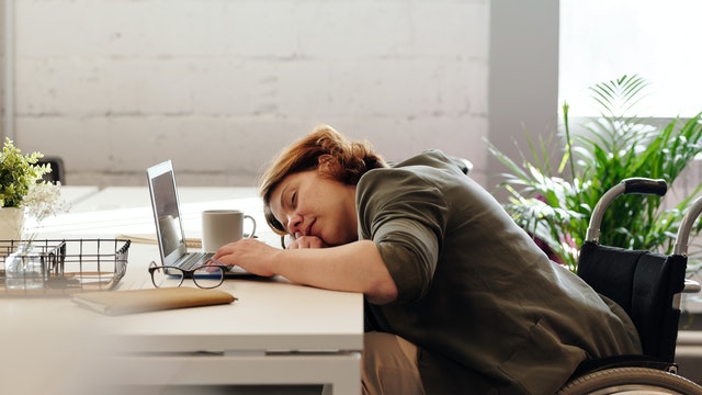 Woman asleep at desk