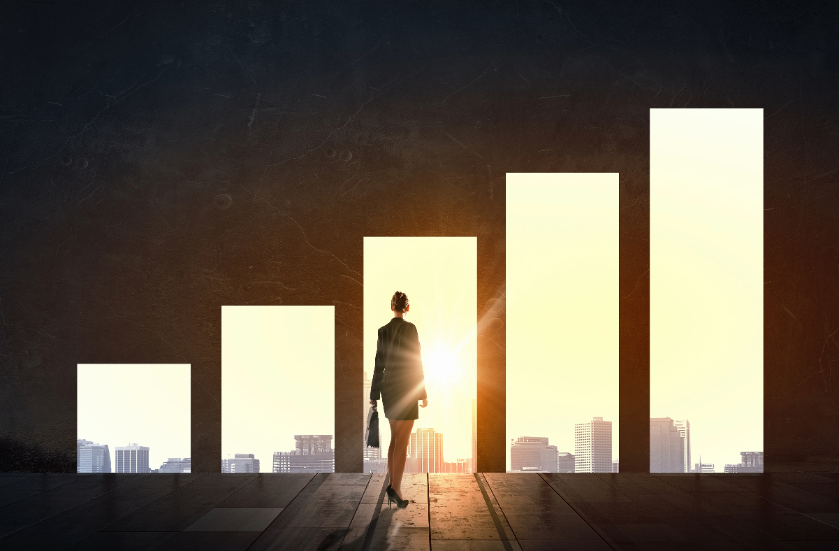Business Women silhouette in front of bar graph