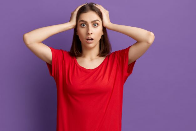 Woman with hands on head, doesn't know what to do