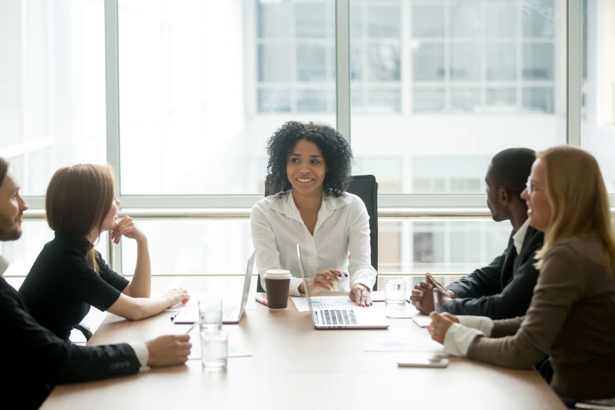 Board of Directors around conference table - D&O Insurance Houston TX