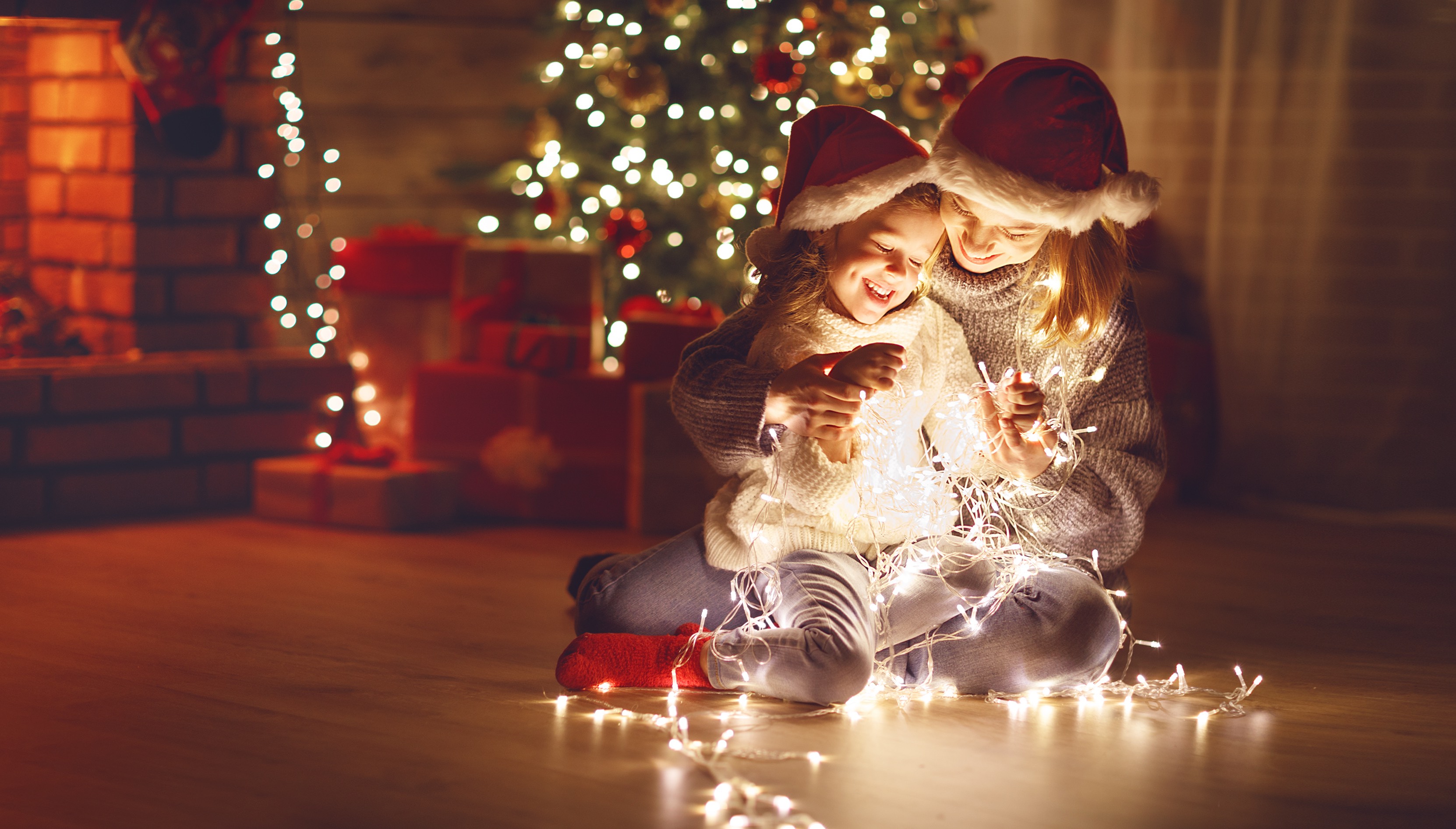 Best Life Insurance - mom and daughter playing with Christmas lights