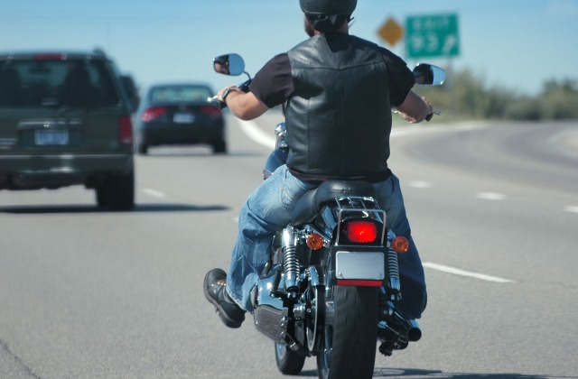 Motorcycle Safety Awareness Month - Motorcyclist driving on highway