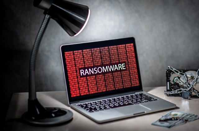 Computer with ransonware graphic on screen. Ransomware Survival Guide