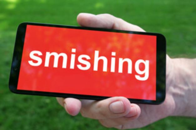 Cell phone with the word smishing on the screen