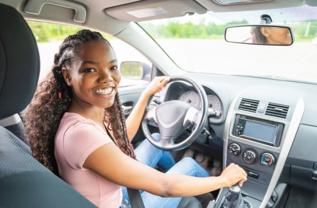 Female teen driver in the driver seat of car - Teen Driver Auto Insurance Discount