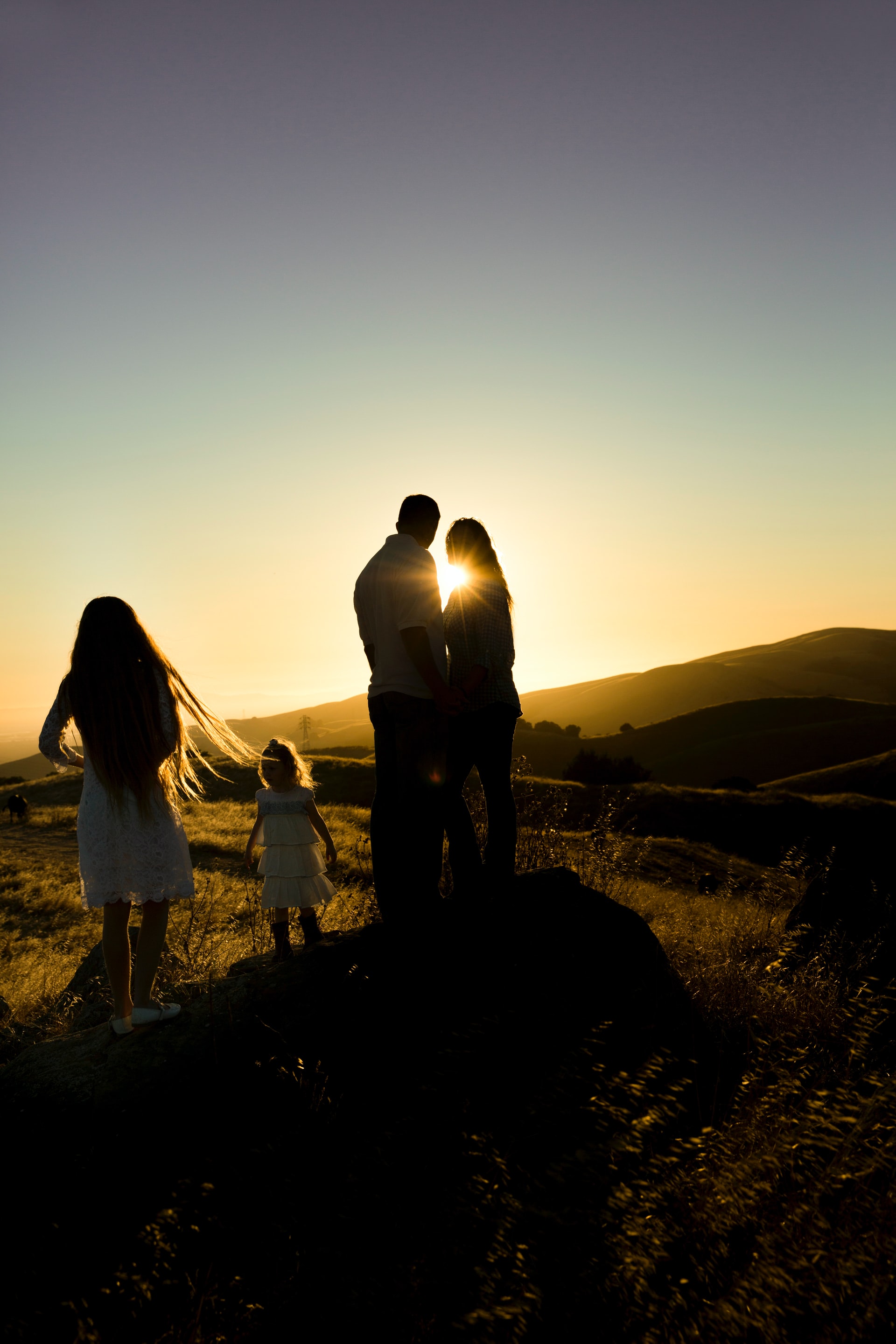 Family silhouette at sunset