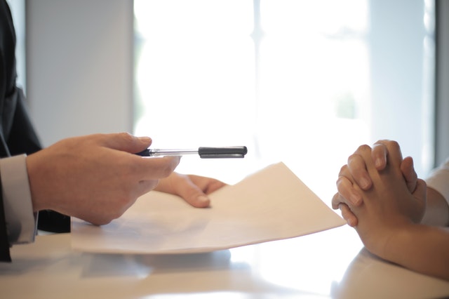 Two parties reviewing paperwork