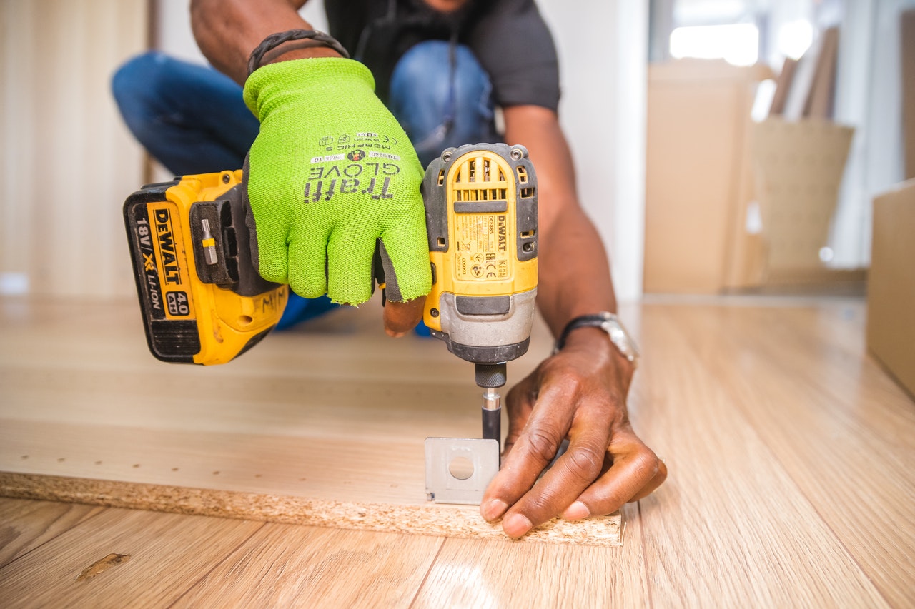 man working with a drill
