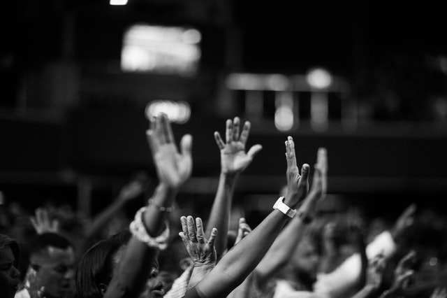 Crowd of hands raised in worship